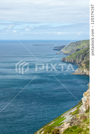 Slieve League cliffs in Ireland rocky slopes meet deep blue Atlantic Ocean with horizon 120374197
