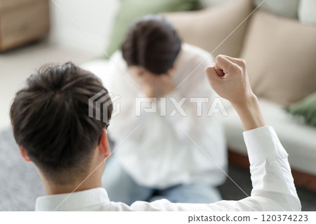 Men and women fighting 120374223