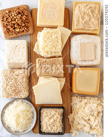 Assorted parmesan cheese blocks, wedges, and shredded pieces Assorted parmesan cheese blocks, wedges, and shredded pieces 120374292