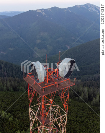 man in hammock on watchtower in a mountains 120374317