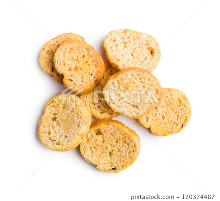 Sliced roasted bruschetta bread isolated on white background. Sliced roasted bruschetta bread isolated on white background. 120374487