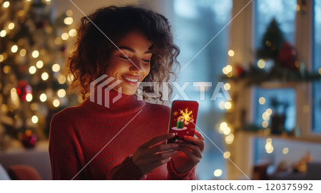 Woman engaging with augmented reality christmas card in cozy holiday setting 120375992
