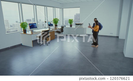 Team of designers designs interior in office room with 3D furniture in virtual space Team of designers designs interior in office room with 3D furniture in virtual space 120376621