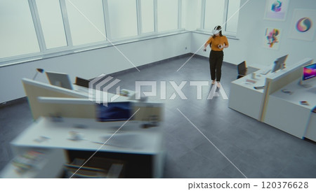 Female designer wearing augmented reality headset uses virtual interior design software Female designer wearing augmented reality headset uses virtual interior design software 120376628