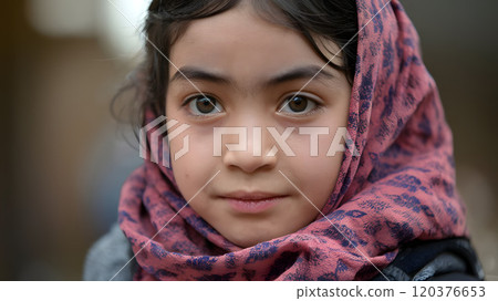 a girl with large, soulful brown eyes, full of depth and wisdom 120376653