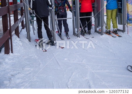 Skiers in Line at a Snowy Ski Resort 120377132
