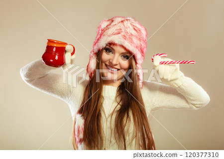 Girl playing with cane and mug. Girl playing with cane and mug. 120377310