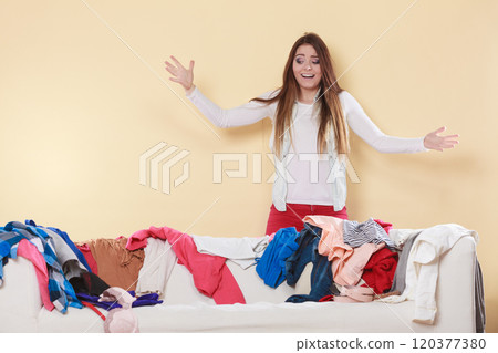 Woman freaking out in messy room home. 120377380