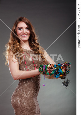 Pretty woman with jewelry necklaces beads and hat. 120377386