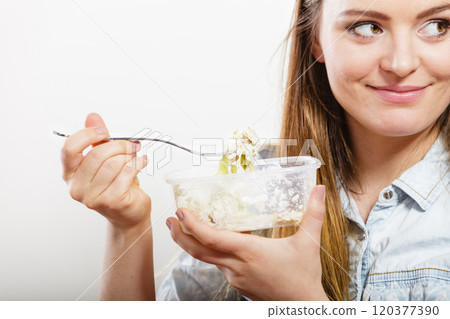 Woman eating fresh vegetable salad. Woman eating fresh vegetable salad. 120377390