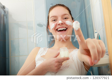 Woman with moisturizing skin cream. Skincare. 120377921
