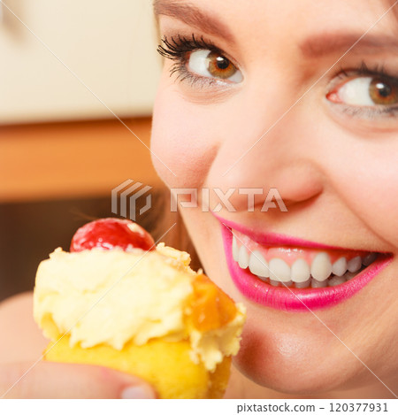 Woman eating delicious sweet cake. Gluttony. 120377931