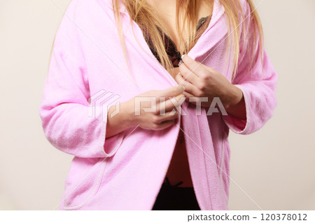 Woman wearing black lingerie and bathrobe 120378012