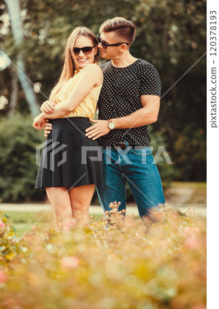 Couple hugging in park. 120378193