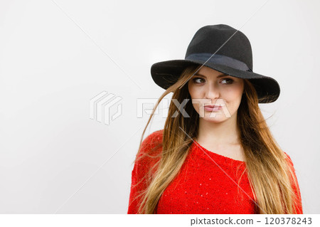 Smiling pretty girl with brown hair and black hat. Smiling pretty girl with brown hair and black hat. 120378243
