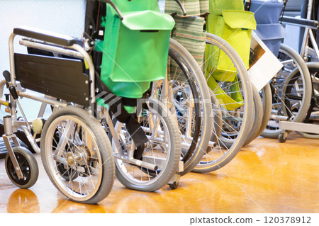 Wheelchairs for elderly care lined up indoors Wheelchairs for elderly care lined up indoors 120378912