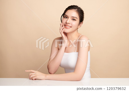 Beautiful young asian woman with clean fresh skin on beige background, Face care, Facial treatment, Cosmetology, beauty and spa, Asian women portrait. 120379632