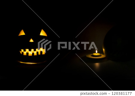 Helloween symbol with scary face behind a candel with fire 120381177