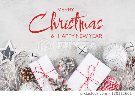 Festive Christmas background with white gift boxes and Christmas decorations. Festive Christmas background with white gift boxes and Christmas decorations. 120381661