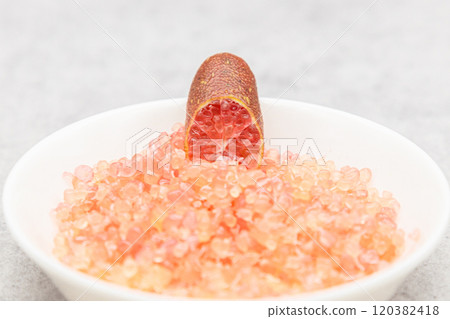 A pile of finger lime pulp in a small white dish A cross section of a finger lime A pile of finger lime pulp in a small white dish A cross section of a finger lime 120382418