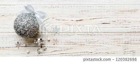 Christmas ball on colored background. decoration bauble with ribbon bow with copy space 120382698