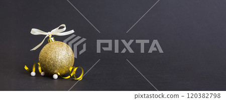 Christmas ball on colored background. decoration bauble with ribbon bow with copy space 120382798