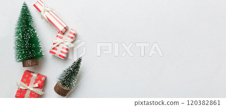 New Year composition. Christmas decor background with gift boxes. Top view with copy space New Year composition. Christmas decor background with gift boxes. Top view with copy space 120382861