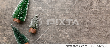 Flat lay composition with christmas trees on color background. Top view with copy space Flat lay composition with christmas trees on color background. Top view with copy space 120382889