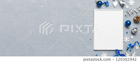 Christmas blank greeting card mock-up scene. Creative layout made of Christmas tree branches and paper card note. Flat lay. Nature New Year concept Christmas blank greeting card mock-up scene. Creative layout made of Christmas tree branches and paper card note. Flat lay. Nature New Year concept 120382942