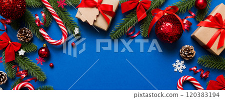 Holiday flat lay with gift boxes wrapped in colorful paper and tied decorated with confetti on colored background. Christmas, Birthday, Valentine and sale concept, top view Holiday flat lay with gift boxes wrapped in colorful paper and tied decorated with confetti on colored background. Christmas, Birthday, Valentine and sale concept, top view 120383194