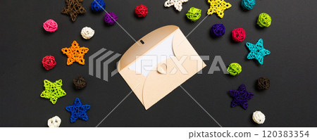 Top view of envelope on black background. New Year decorations. Christmas holiday concept 120383354
