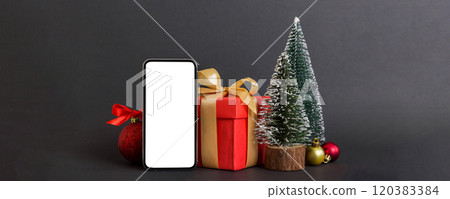 Digital phone mock up with rustic Christmas decorations for app presentation with empty space for you design. Christmas online shopping concept. Tablet with copy space on colored background Digital phone mock up with rustic Christmas decorations for app presentation with empty space for you design. Christmas online shopping concept. Tablet with copy space on colored background 120383384