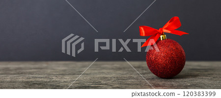 Christmas ball on colored background. decoration bauble with ribbon bow with copy space Christmas ball on colored background. decoration bauble with ribbon bow with copy space 120383399