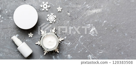 Makeup products and Christmas decorations on color background. Top view New year Beauty concept Makeup products and Christmas decorations on color background. Top view New year Beauty concept 120383508