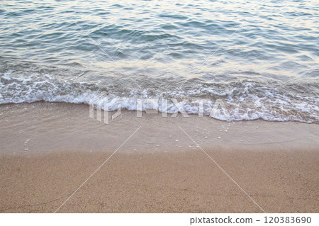 The beach with sea waves running on the sand. Beautiful view on the waves 120383690