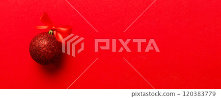 Christmas ball on colored background. decoration bauble with ribbon bow with copy space 120383779