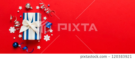 Top view Flat lay Christmas decorations and gift box on colored background with copy space. Christmas or Happy New Year composition Top view Flat lay Christmas decorations and gift box on colored background with copy space. Christmas or Happy New Year composition 120383921