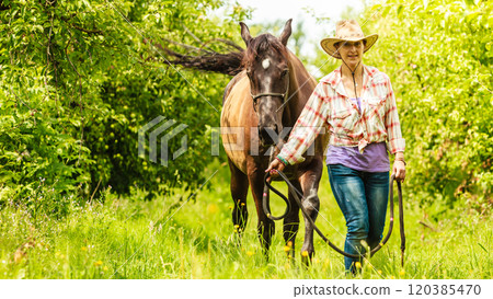 Western cowgirl woman with horse. Sport activity Western cowgirl woman with horse. Sport activity 120385470