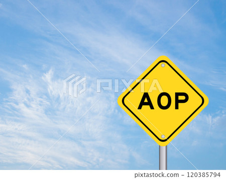 Yellow transportation sign with word AOP (abbreviation of Annual Operating Plan or Aspect-oriented programming) on blue color sky background 120385794