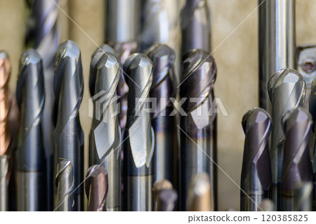 Close-up scene the group of used cutter end mill tools. Close-up scene the group of used cutter end mill tools. 120385825