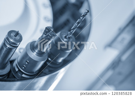 The indexable tool in the tool magazine of machining center in the light blue scene. 120385828