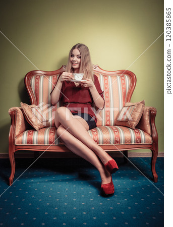 Woman drinking hot coffee beverage. Caffeine. 120385865