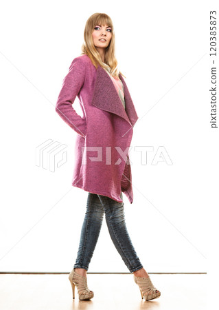 blonde fashionable woman in vivid color coat. 120385873