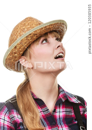 Shocked and surprised gardener woman looking up 120385935