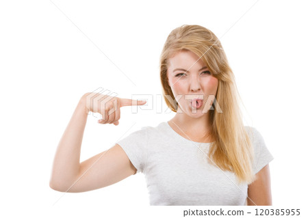 Funny blonde woman sitcking tongue out 120385955