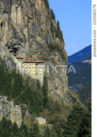 Image of the monastery built into the rocks on the mountainside. 120386578