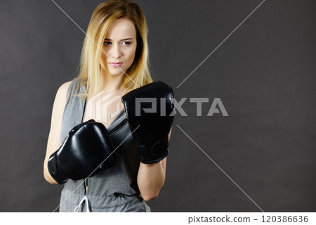 Boxer girl exercise with boxing gloves. 120386636