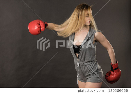 Beautiful woman with red boxing gloves 120386666