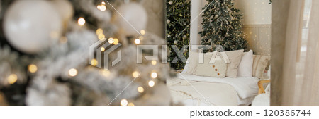 Banner bright modern bedroom with a large Christmas tree 120386744