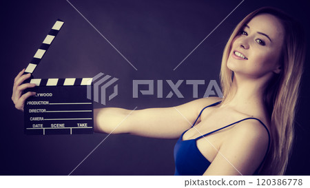 Woman holding professional film slate Woman holding professional film slate 120386778